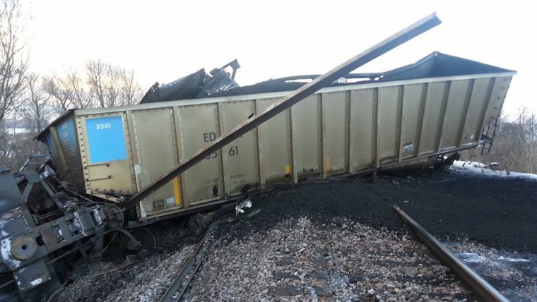 State officials say the extreme cold caused 19 rail cars carrying coal to derail Sunday in Caledonia, Wis.