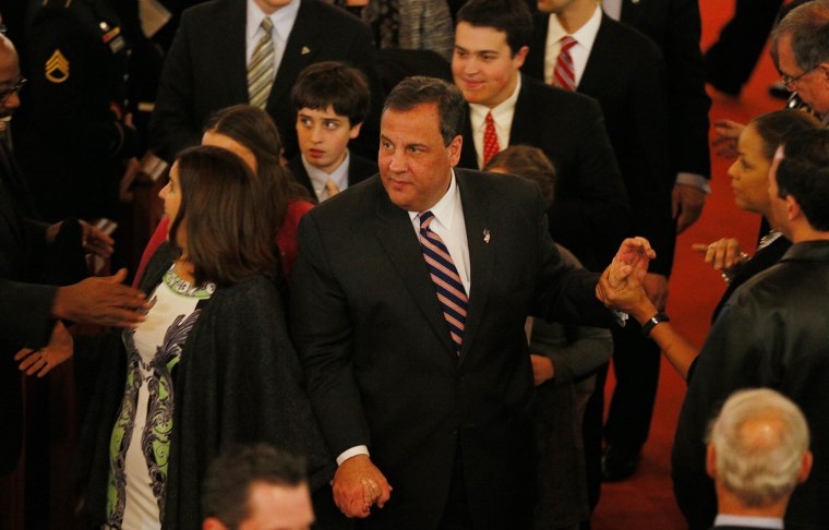 Governor Chris Christie leaves with his family after attending his inauguration service in Newark, New Jersey, January 21, 2014.