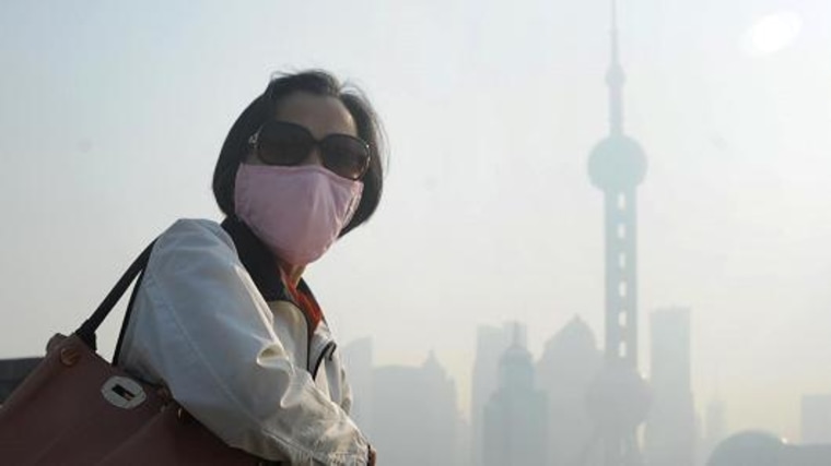 Pedestrians wearing masks are a common sight in China's cities, as here in Shanghai.