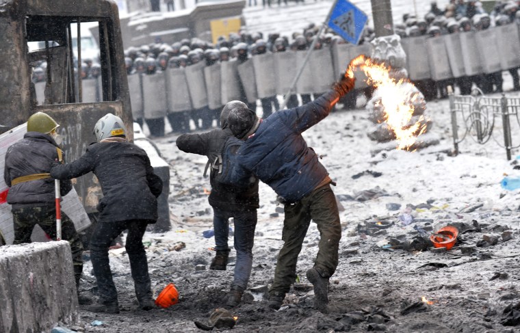 Protesters clash with the police in the center of Kiev on Wednesday.