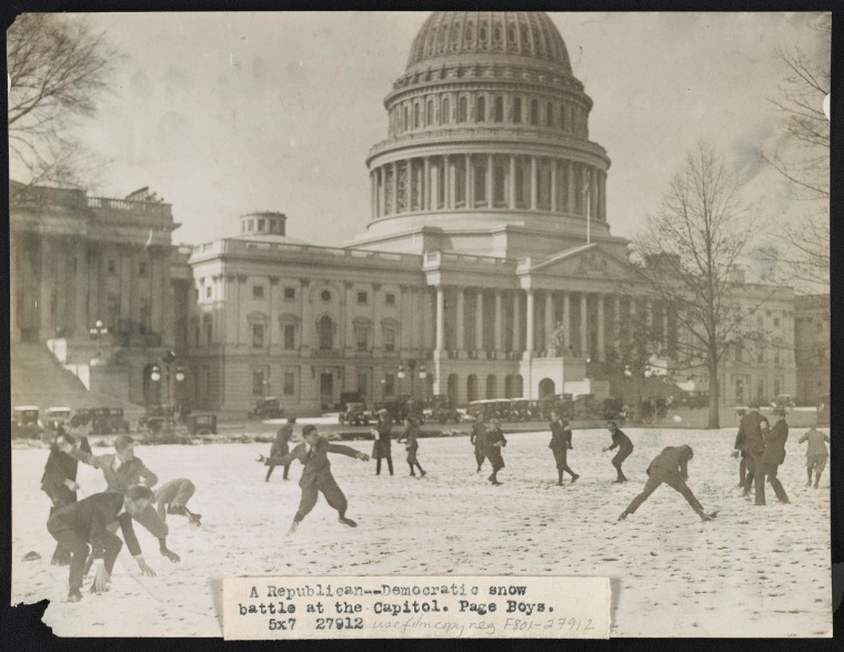 A Republican-Democratic snow battle at the Capitol. Page boys