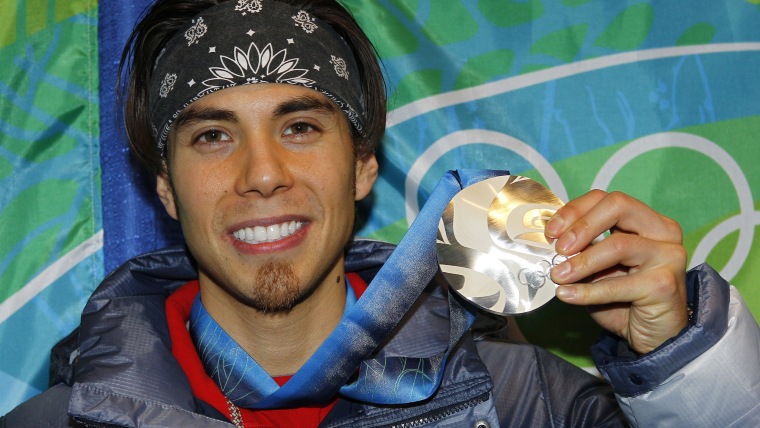 Apolo Anton Ohno of the U.S. poses with his silver medal at the medal ceremony for the men's 1500 metres short track speed skating competition during ...