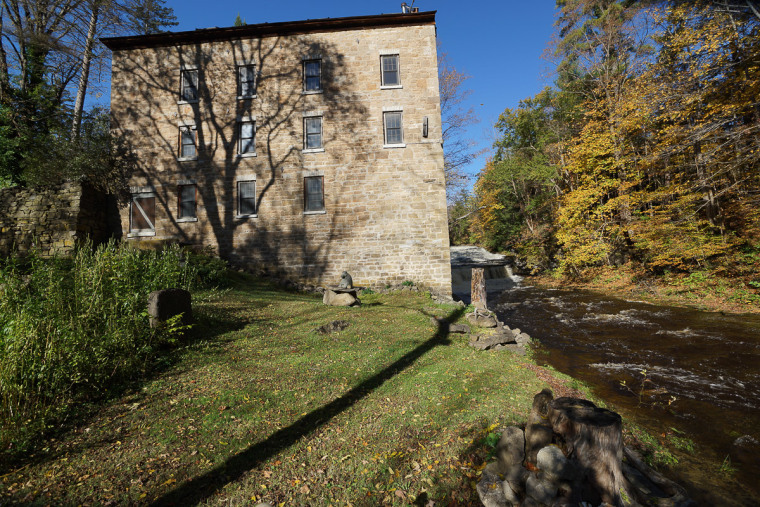 This four-story former mill is set along waterfalls in St. Johnsville, N.Y.