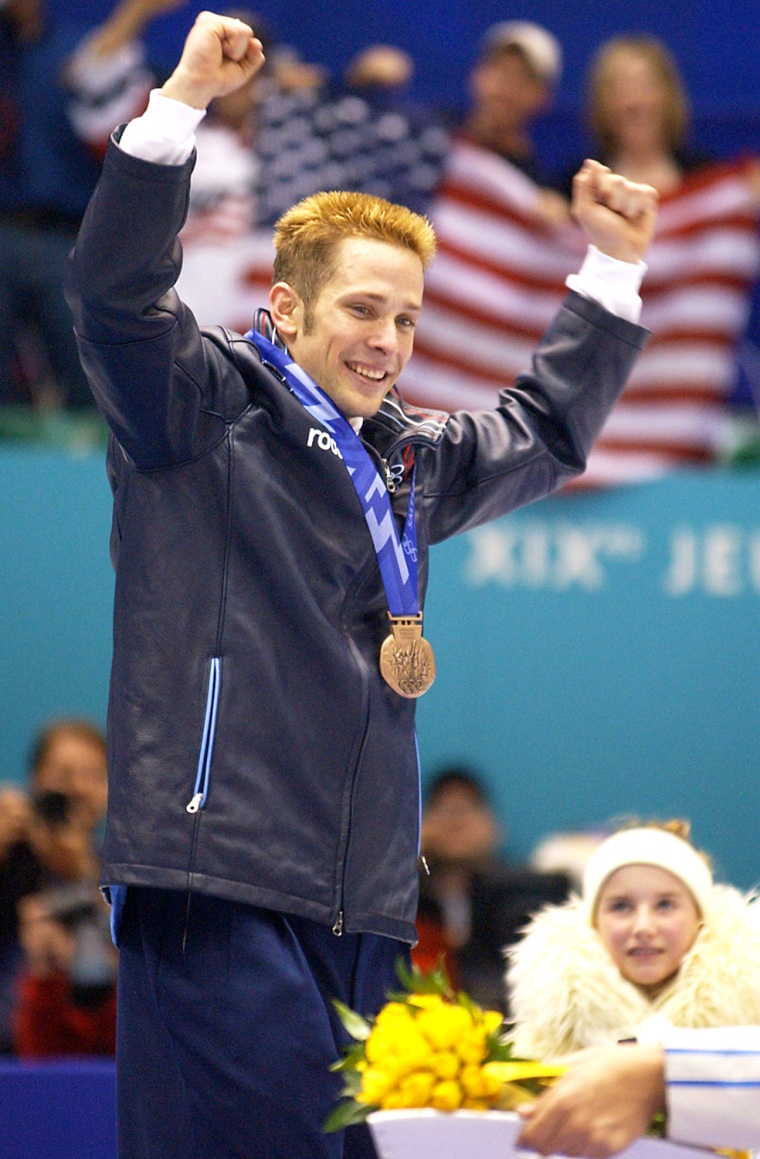 Rusty Smith jubilates on the podium of the men's 500 meter short track speed skating event on Feb. 23, 2002 during the Winter Olympics in Salt Lake City.