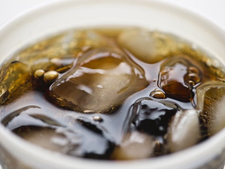 Close-up of soda in disposable cup