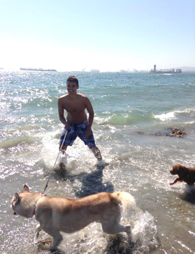 Image: Eric Curry with dog on beach