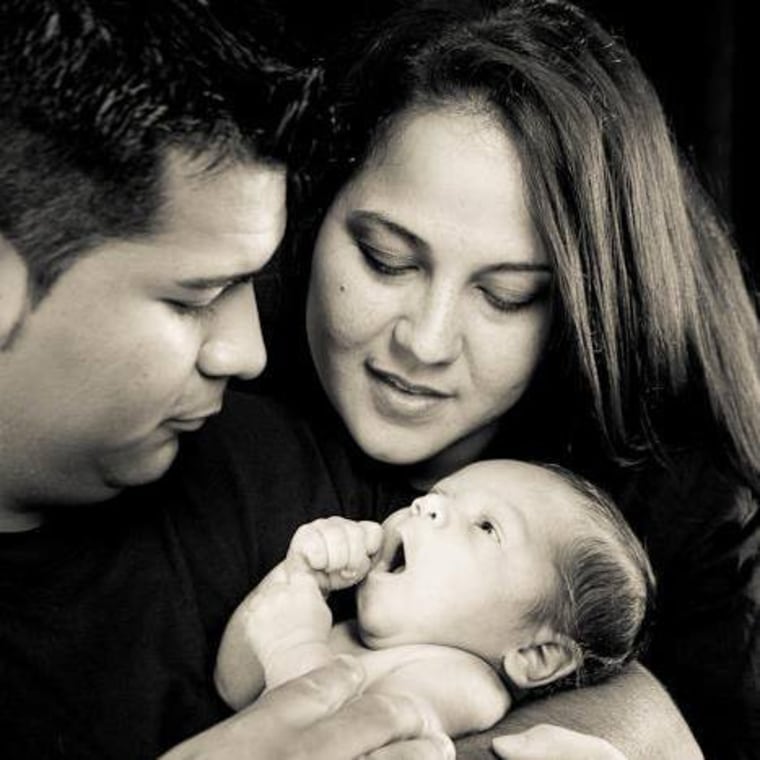 Erick and Marlise Munoz hold their son Mateo.