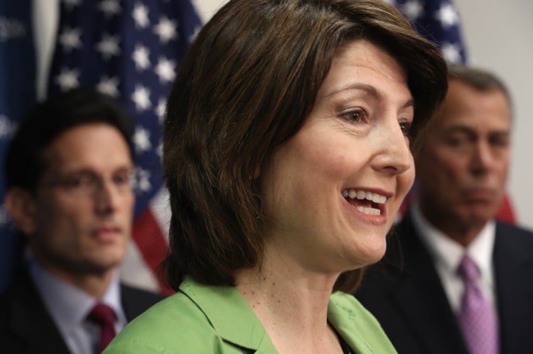 Rep. Cathy McMorris Rodgers, R-Wash., speaks as Speaker of the House Rep. John Boehner, R-OH, and House Majority Leader Rep. Eric Cantor, R-Va., (L) listen during a news briefing after a House Republican Conference meeting January 14, 2014 on Capitol Hill in Washington, D.C.