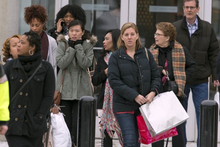 Shoppers are evacuated by police after a shooting Saturday at a malll in Columbia, Md.