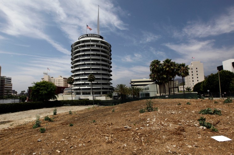 The Capitol Records building is seen in August beyond a vacant lot that is near what geologists describe as an escarpment, an uplifting of land that may indicate the presence of an earthquake fault.