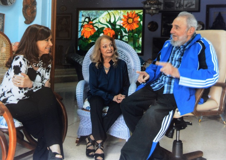 Argentina's President Cristina Fernandez, left, talks with Cuban leader Fidel Castro, right, and Fidel's wife Dalia Soto del Valle during a private meeting, on Sunday, Jan. 26, 2014 in Havana, Cuba.