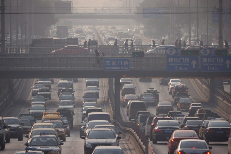 This Nov. 25, 2011, photo shows heavy midmorning traffic amidst air pollution in Beijing, China. While some European cities are pondering going carless, or at least reducing traffic, emerging markets also are grappling with the matter. Beijing, Shanghai and a number of other Chinese cities have been enacting rules to reduce the number of new vehicles that can be sold and registered.