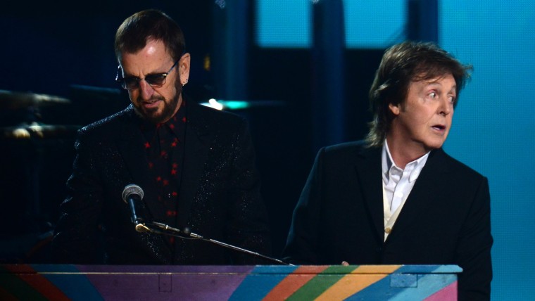 Former Beatles members Paul McCartney (R) and Ringo Star perform on stage during the 56th Grammy Awards at the Staples Center in Los Angeles, Californ...