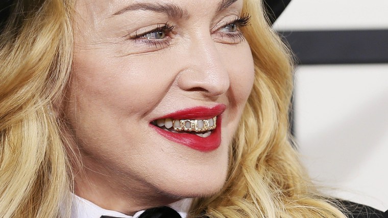 Madonna arrives at the 56th annual Grammy Awards in Los Angeles, California January 26, 2014.     REUTERS/Danny Moloshok (UNITED STATES TAGS: ENTERTAI...
