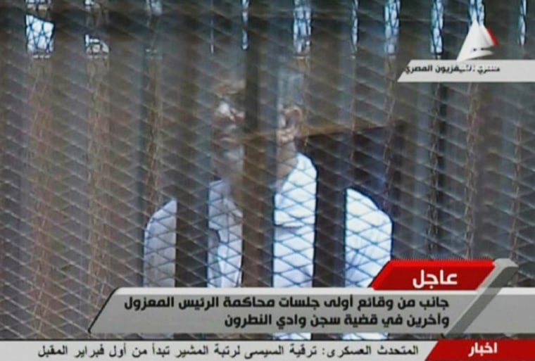 Deposed Egyptian president Mohamed Morsi appears in a makeshift courtroom on the outskirts of Cairo on Tuesday.
