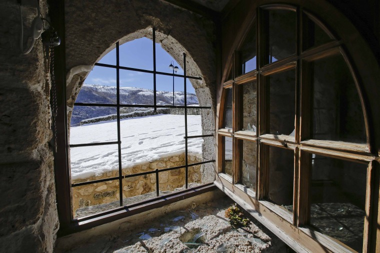 A broken window in the small mountain church of San Pietro della Ienca.