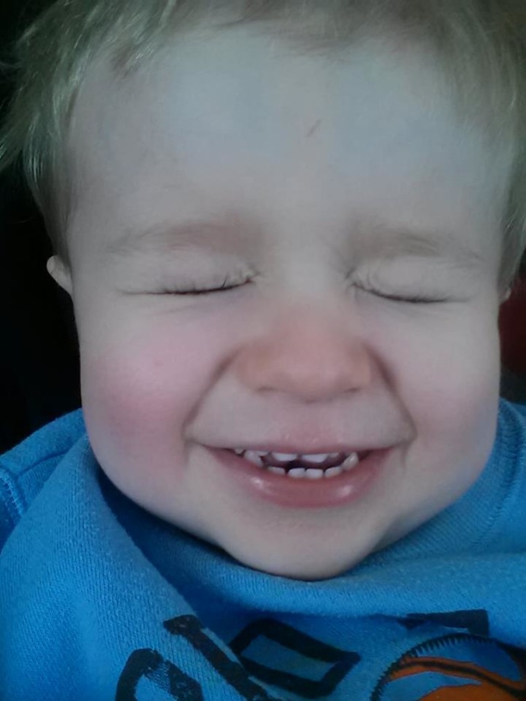 Tyce winking at himself after his nap.