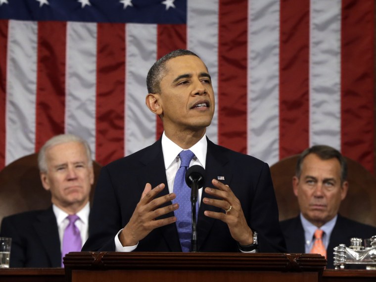 President Barack Obama, flanked by Vice President Joe Biden and House Speaker John Boehner of Ohio, gestures as he gives his State of the Union addres...