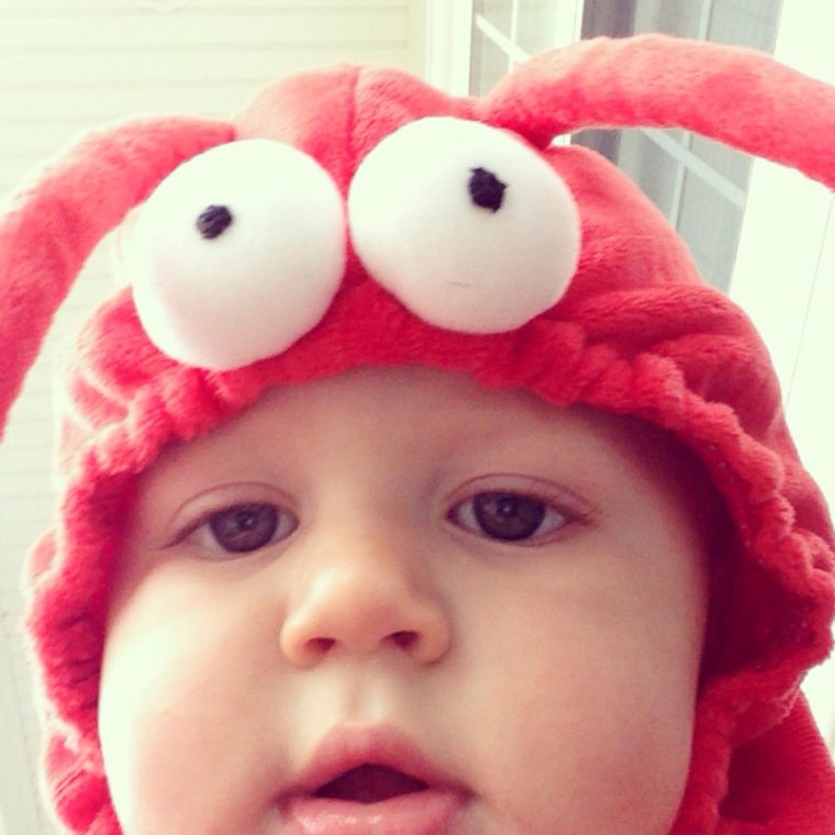 Aiden playing with my phone on Halloween -- he was a lobster.