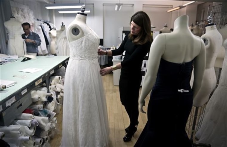 David's Bridal senior vice president Michele von Plato arranges a dress on a plus-size mannequin in New York.