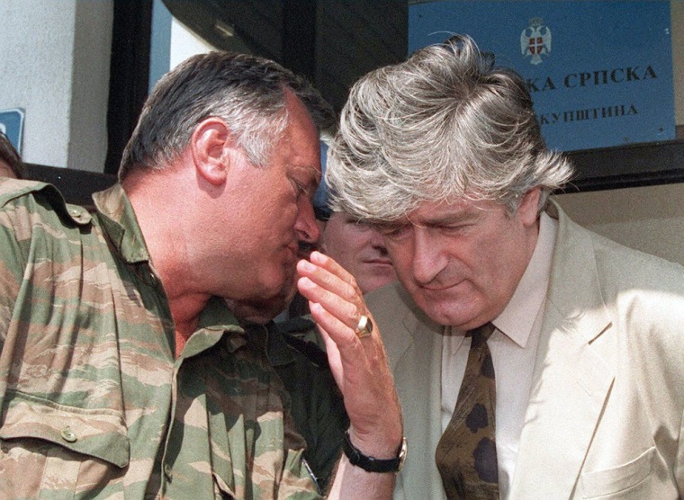 This picture taken on August 5, 1993 shows Bosnian Serb leader Radovan Karadzic, right, listening to Bosnian Serb Commander Ratko Mladic during a meeting with the press in Pale. Mladic refused to testify at the trial of his former political counterpart Karadzic on Tuesday, despite a subpoena issued by the Yugoslav war crimes court.