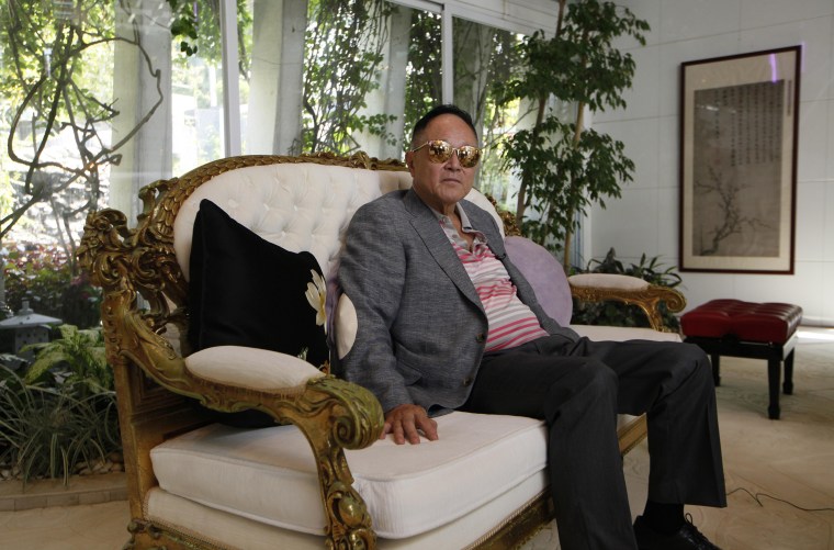 Cecil Chao, chairman of Hong Kong property developer Cheuk Nang Holdings, poses in his house in Hong Kong in 2012.