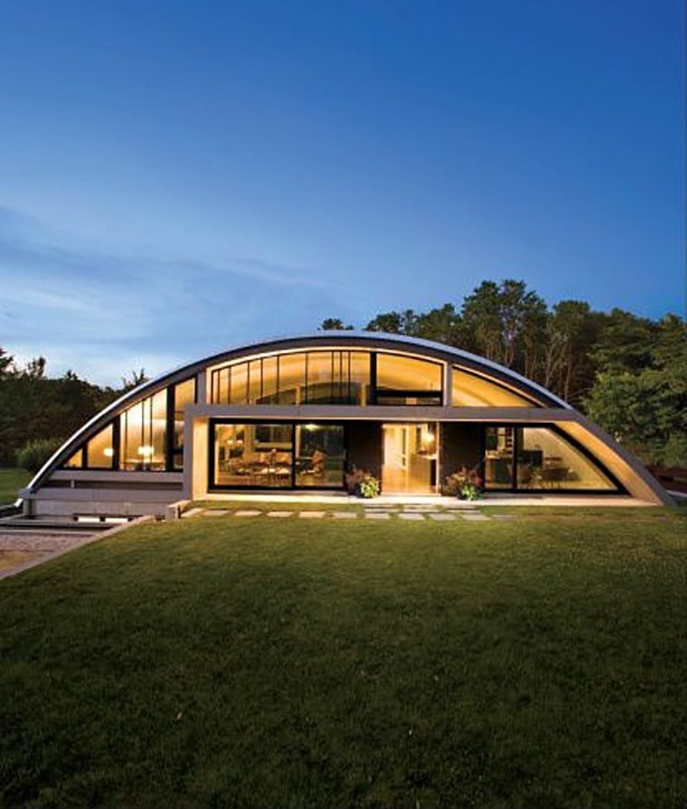 The Arc House stands 16 feet tall and spans 20 feet by 60 feet.