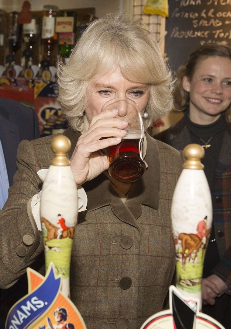 Camilla, Duchess of Cornwall, samples a pint of draught beer during a visit to The Bell pub in Purleigh on January 29.