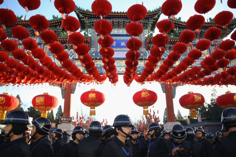Security personnel line up before the opening ceremony of the Spring Festival Temple Fair at the Temple of Earth park in Beijing, China on Thursday.