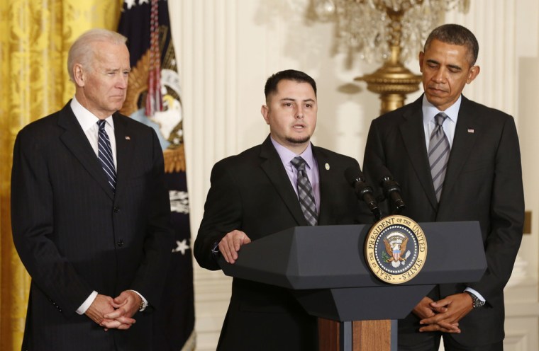 President Barack Obama (right) and Vice President Joseph Biden listen to apprentice electrician Erick Varela (center) of Pacific Gas and Electric discuss his previous unemployment, in the East Room of the White House on Jan. 31. A veteran, Varela couldn't find work when he returned from Iraq in 2008 and ended up homeless for a time.