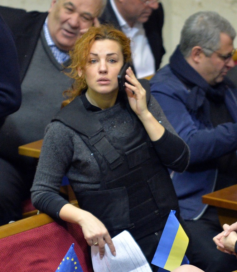 Lesya Orobets, a deputy of the opposition Batkivshchyna (Fatherland) party, wears a bulletproof vest during an extraordinary session of the Ukrainian parliament on Jan. 28, 2014.