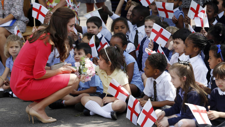 Britain's Catherine, Duchess of Cambridge, greets children of the Blessed Sacrament Catholic School in London July 1, 2014. Catherine, known as Kate, ...