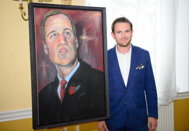British artist Dan Llywelyn Hall poses for a photograph following the unveiling of the new portrait of the Duke of Cambridge, at the Welsh Office in c...