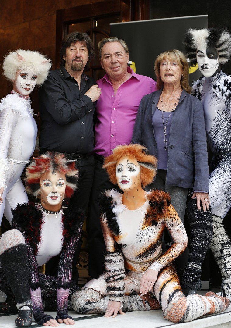 British composer Andrew Lloyd Webber, center, director Trevor Nunn, centre left, and choreographer Gillian Lynne, centre right, with cast members of \"Cats\"