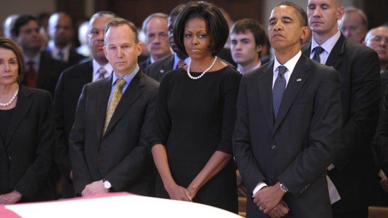 From left, House Speaker Nancy Pelosi of Calif., Delaware Gov. Jack Markell, first lady Michelle Obama and President Barack Obama, and others, attend ...