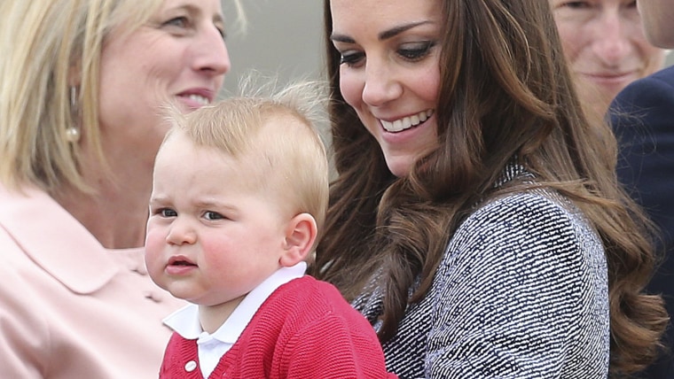 Kate, the Duchess of Cambridge, holds Prince George as they say  goodbye before they board their flight in Canberra,  Australia, Friday, April 25, 201...