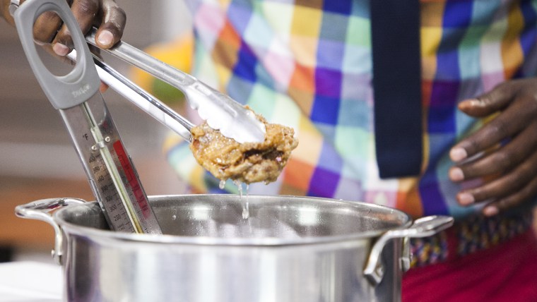 Marcus Samuelsson and Willie Geist go over how to make fried chicken on the TODAY show in New York, on July 9, 2014.