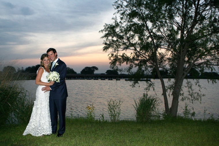 Jenna and her husband, Henry Hager, pose along the lake at Prairie Chapel Ranch following their wedding ceremony on May 10, 2008.