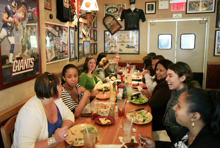 In this June 3, 2009 photo, customers enjoy lunch at an Applebee's Neighborhood Grill & Bar, in New York. (AP Photo/Mark Lennihan)