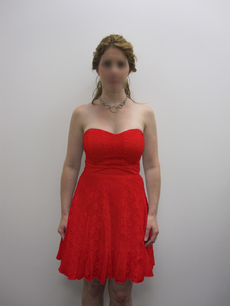 This is the picture used for the color manipulation in Experiments 1 and 2 (the face of the female target was intact in the experiment but is blurred here to protect privacy). The dress color was red or white.
