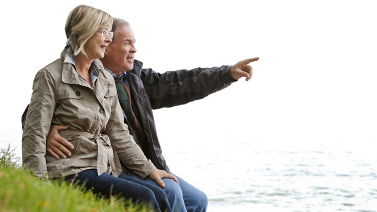 older casual couple sitting in the grass outdoors; Shutterstock ID 114427078; PO: today.com