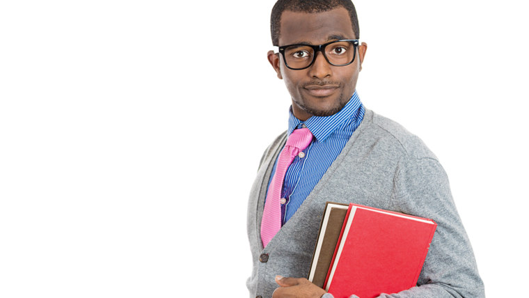 Closeup of a young smart handsome man, wearing big glasses, holding books, prepared and ready to ace his exam test finals, isolated on white backgroun...