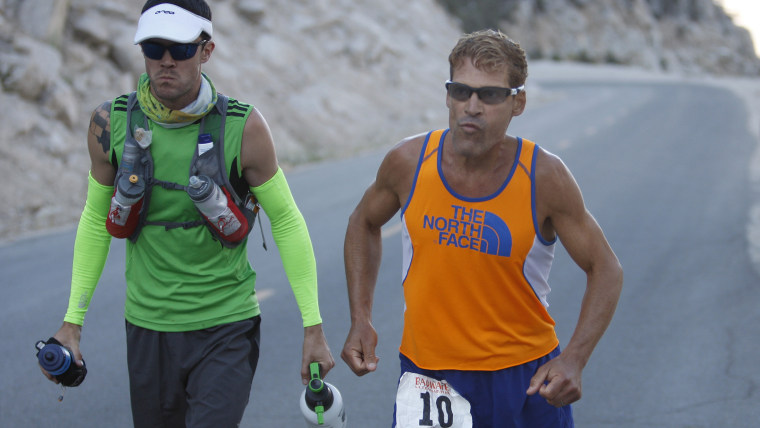 DEATH VALLEY NATIONAL PARK, CA JULY 16:  Dean Karnazes of Ross, California runs stiff with pain as he ascends the last few miles of Whitney Portal Roa...