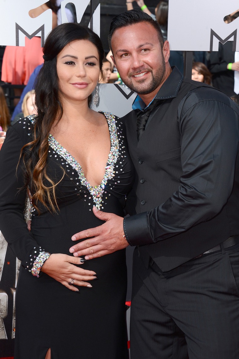 Jennifer \"JWoww\" Farley, left, and Roger Mathews arrive at the MTV Movie Awards on Sunday, April 13, 2014, at Nokia Theatre in Los Angeles. (Photo by ...