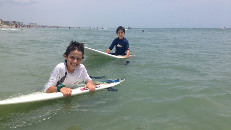 Sebastian Cozzan, 9, with his little brother Alejandro, 7, on Memorial Day weekend in Cocoa Beach, Fla. It was the first time Sebastian was back in th...