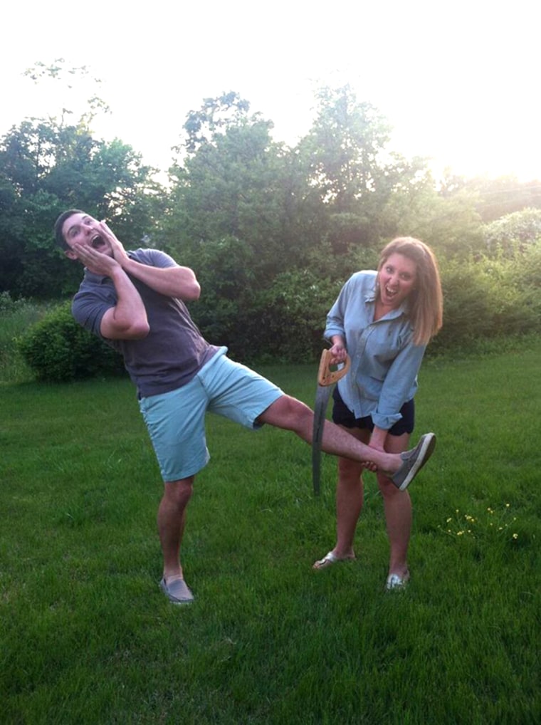 Joe Pleban and his girlfriend, Johnna Hetrick, pretend to saw off Joe's foot.