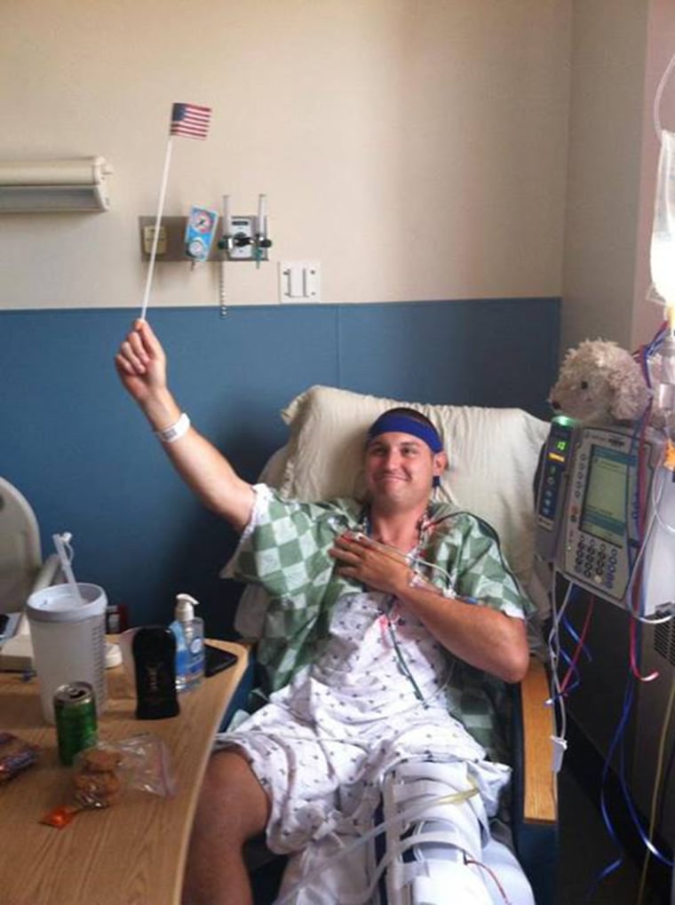 Joe is pictured supporting the USA men's soccer team in the World Cup in the hospital after his surgery.