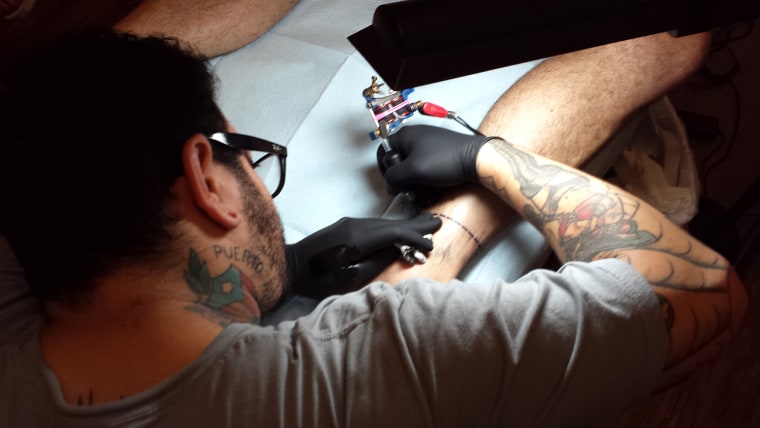Joe Pleban gets a tattoo