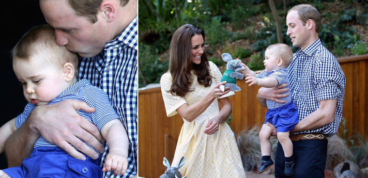 Prince William kisses Prince George as they look at an Australian animal called a Bilby, which has been named after the young Prince, during a visit t...