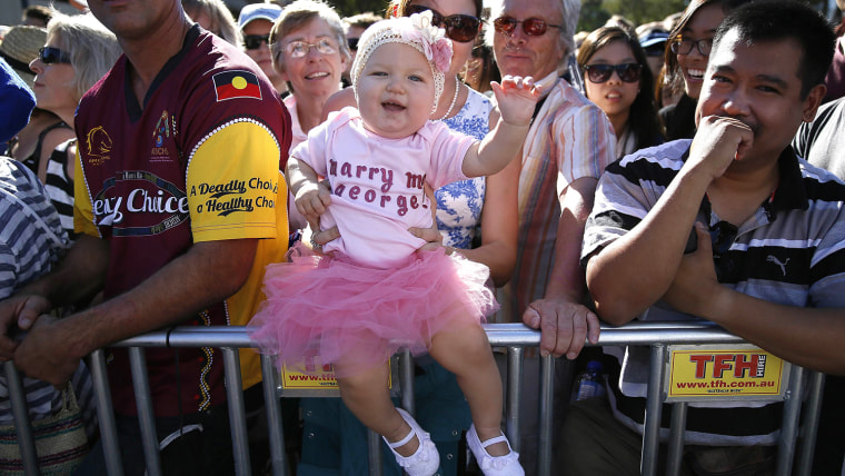 Grace Farrelly, 10 month old, waits with her mother to see Britain's Prince William and his wife Catherine, Duchess of Cambridge, in Brisbane, April 1...